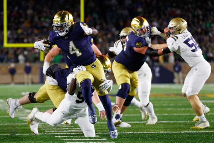Notre Dame running back Jeremiyah Love (4) runs with the ball during the first half of a NCAA football game against Navy at