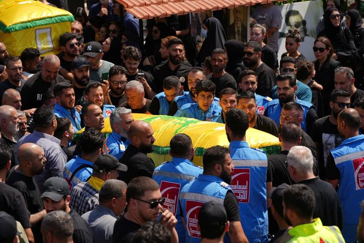 Mourners attend the funeral of two Hezbollah fighters, who were killed before an interim deal between the U.S. and Iran in Nabatieh