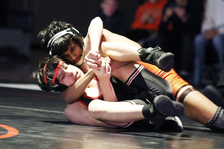 Lexington boys win dual over Cozad