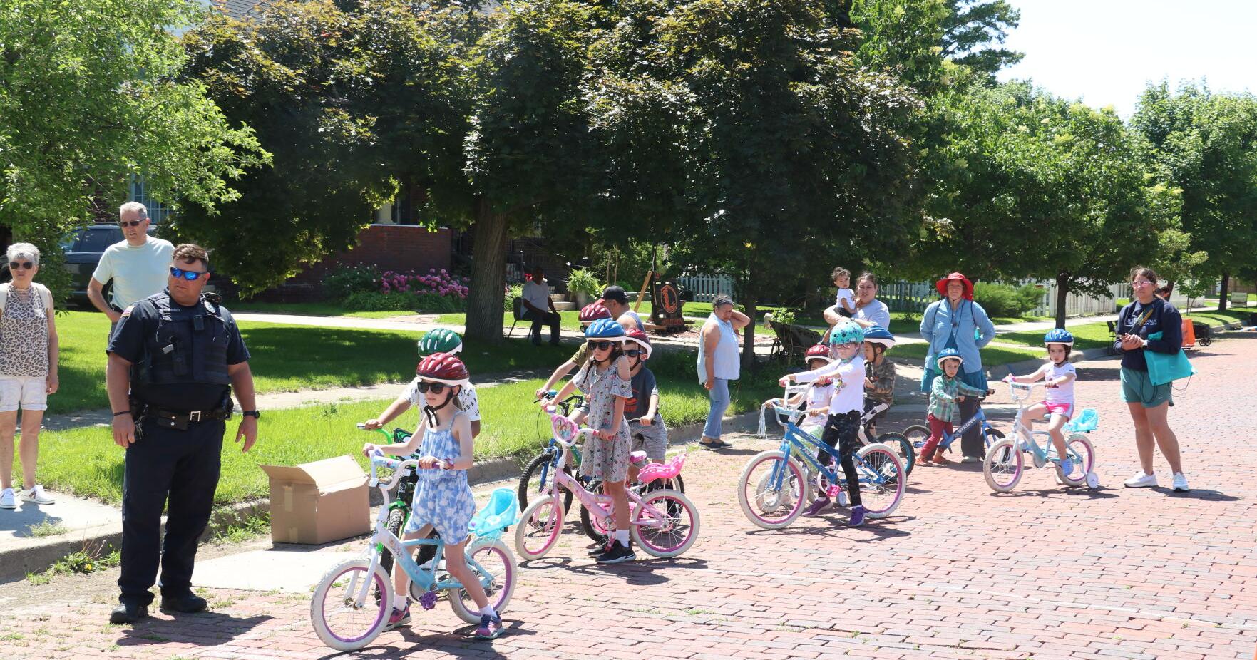 Kids learn bike safety, get free helmets at library event - Vimarsana News