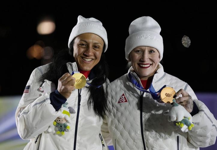 Elana Meyers Taylor of the United States and Kaillie Armbruster Humphries of the United States celebrate on the podium after the women's bobsleigh monobob competition during the Milano Cortina 2026 Olympic Winter Games at Cortina Sliding Centre on Feb 1...