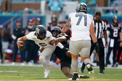 David Bailey of the Texas Tech Red Raiders sacks Dante Moore of the Oregon Ducks during the first quarter during the 2025 College Football Playoff Quarterfinal at the Capital One Orange Bowl at Hard Rock Stadium on Thursday, Jan. 1, 2026, in Miami Garde...