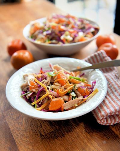 Chinese chicken salad features pulled rotisserie chicken, orange segments and cabbage in a tangy soy sauce-based dressing.