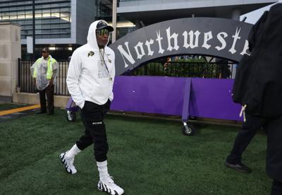 Colorado head football coach Deion Sanders enters the field for a game against Northwestern at Martin Stadium on Saturday, Sept. 19, 2026, in Evanston, Ill..