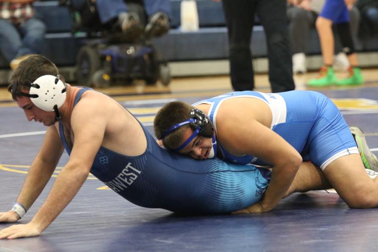 Overton wrestling at Elm Creek trianuglar