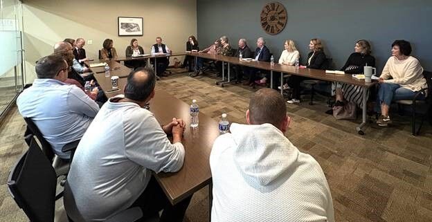 Pillen visits with Lexington leaders