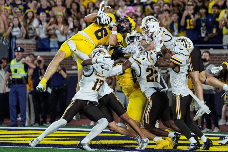 Michigan wide receiver JJ Buchanan (6) catches a 47-yard touchdown on a Hail Mary against Western Michigan to win, 13-12, as