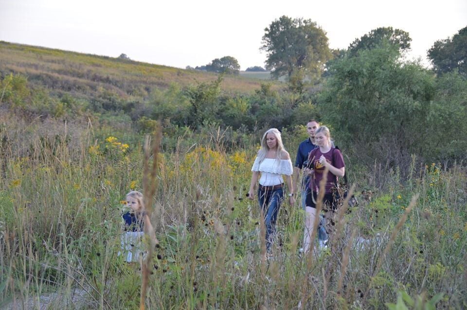 Family walk on a prairie trail