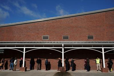 FILE PHOTO: Early voters queue to cast their votes in Georgia