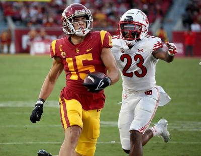 USC receiver Drake London heads into the end zone with a 20- yard touchdown catch against Utah in the first half at the Los Angeles Memorial Coliseum on Saturday, Oct. 9, 2021.