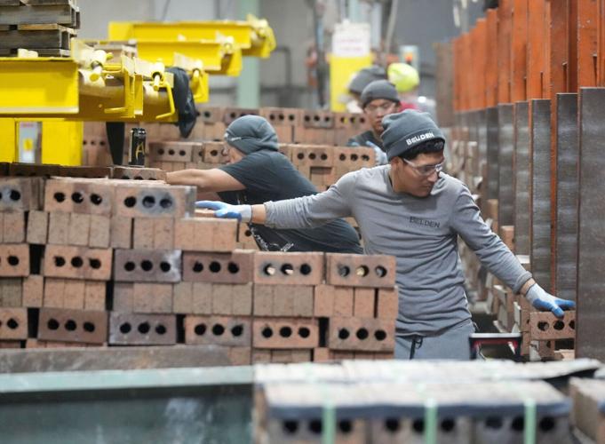 Workers package and cube pallet bricks for shipping at Belden Brick in Sugarcreek, Ohio