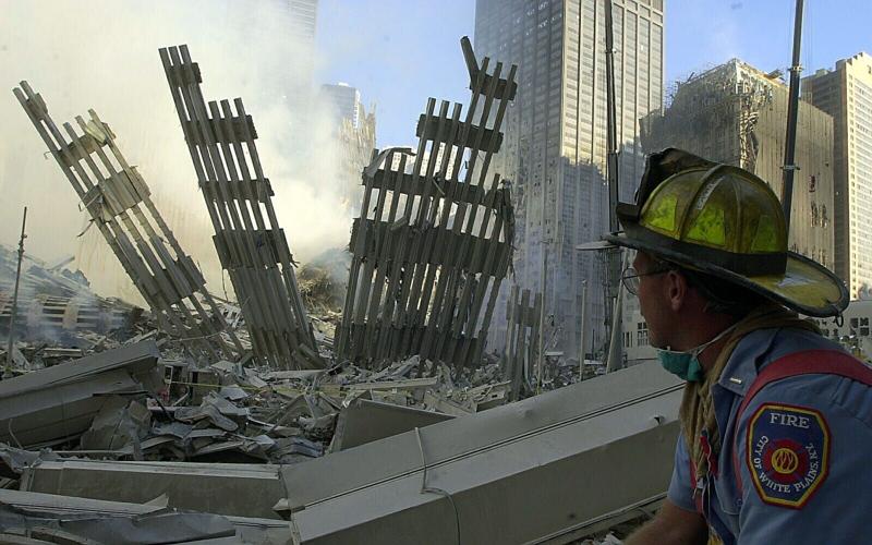 White Plains Fire Department Lieutenant Rich Houlihan surveys damage at the World Trade Center Sept. 12, 2001.