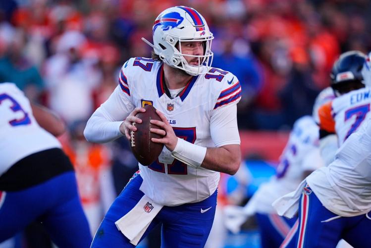 Buffalo Bills quarterback Josh Allen (17) rolls out during the second quarter of an AFC Divisional Round playoff game against the Denver Broncos at Empower Field at Mile High in Denver on Jan. 17, 2026.