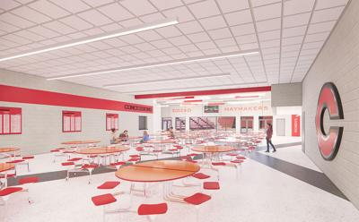 2103-Cozad-Middle-School-and-High-School-Commons-Perspective-Towards-Gym-1.jpg