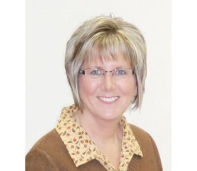 Retiring Dawson County clerk honored at County Board meeting
