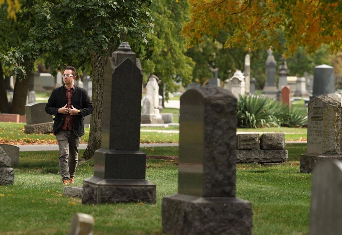 Graceland Cemetery guide and author Adam Selzer walks through the cemetery on Oct. 22, 2024, in Chicago.