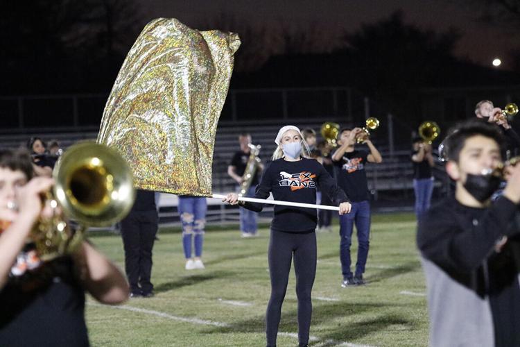 With no competitions to attend, Pride of the Minuteman Marching Band performs for the Lexington community