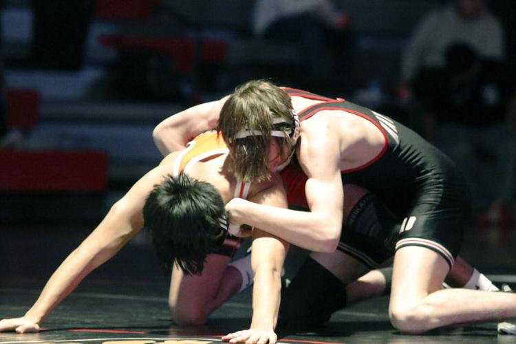Lexington boys win dual over Cozad