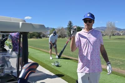 Zach Everett plays golf with friends at West Woods Golf Club in Arvada, Colo., on Wednesday, March 25, 2026. Everett's sports gambling cost him a job and alienated most of his friends and family.  "You're not going to win yourself out of whatever hole y...