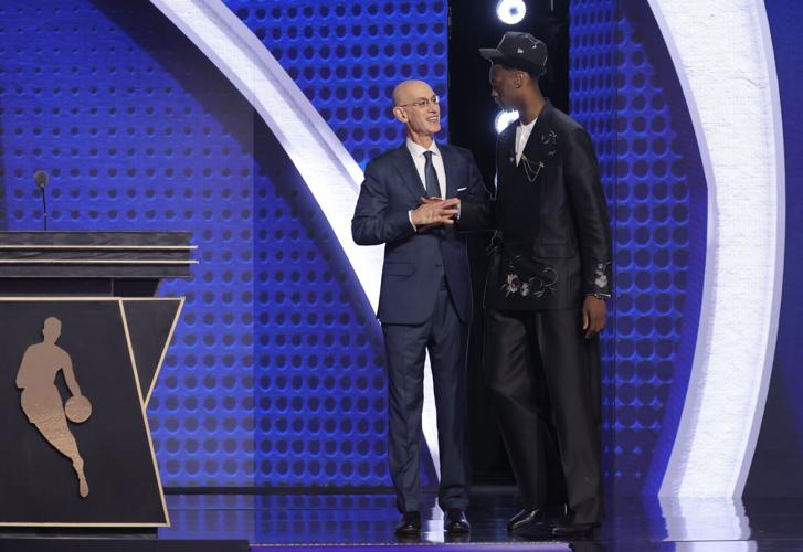 NBA Commissioner Adam Silver poses with AJ Dybantsa, the first pick in the 2026 NBA Draft selected by the Washington Wizards, at Barclays Center in New York on June 23, 2026.
