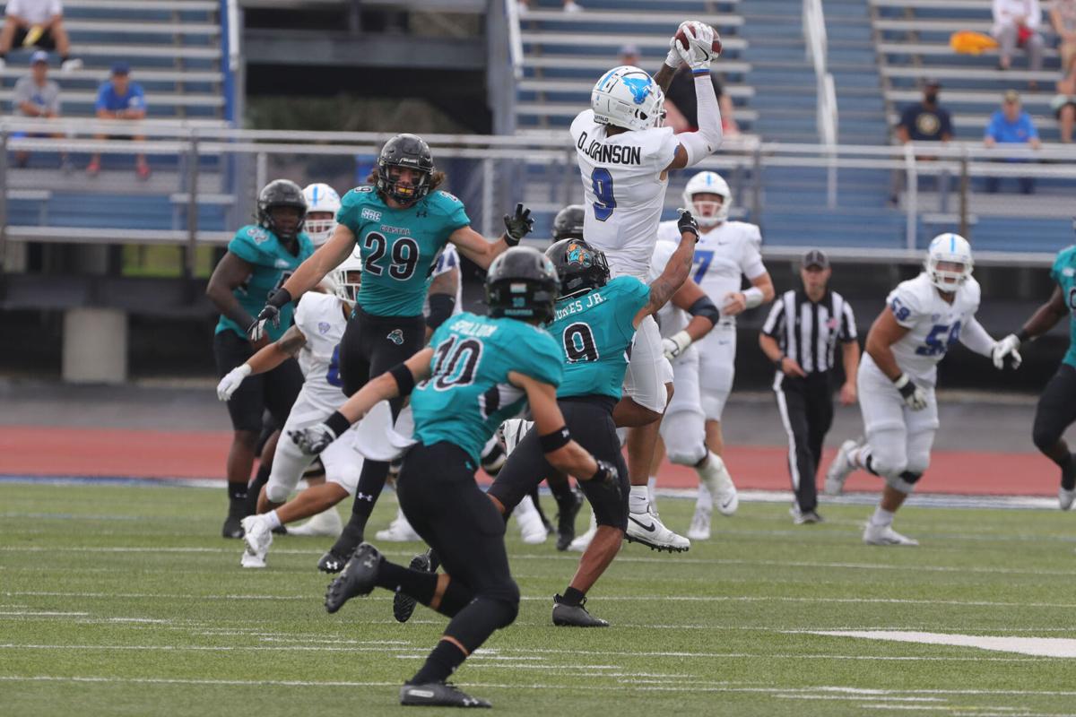UB Bull's wide receiver Dominic Johnson (9) hauls in a reception
