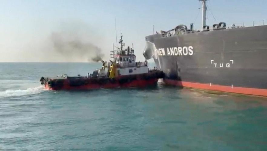 Water is sprayed on oil tanker New Andros, at Sea