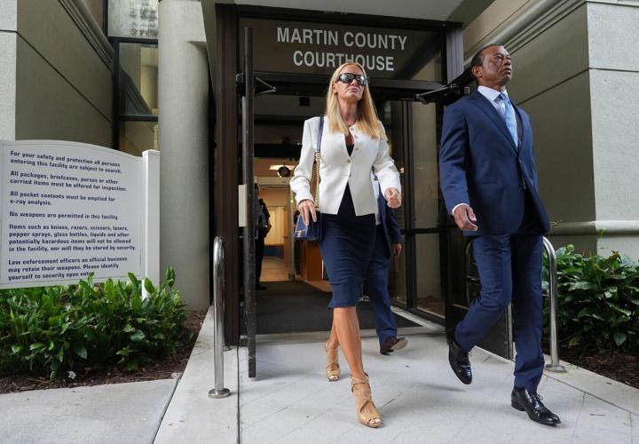Tiger Woods leaves the Martin County Courthouse with girlfriend Vanessa Trump, Sept. 2, 2026, after a change of plea hearing