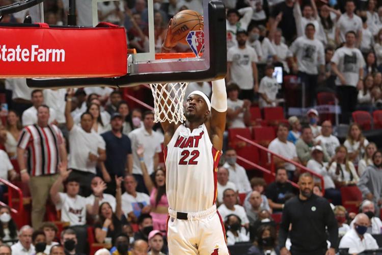 Miami Heat forward Jimmy Butler dunks against the Boston Celtics during the first half of Game Seven of the Eastern Conference Finals playoff game at FTX Arena on Sunday, May 29, 2022 in Miami.