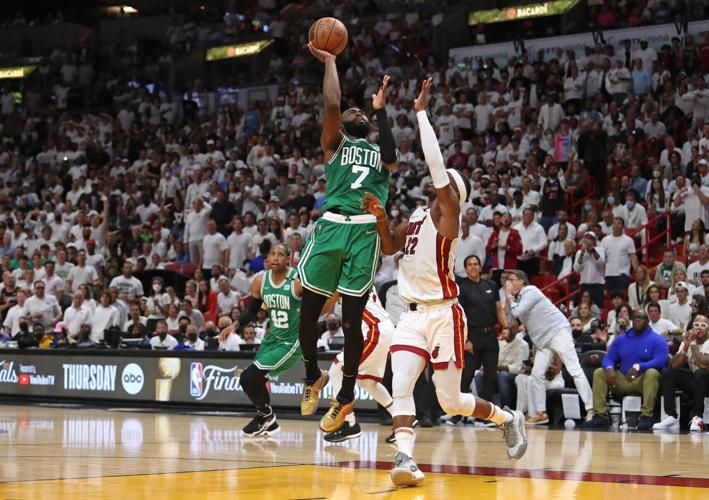 Boston Celtics forward Jaylen Brown shoots over Miami Heat forward Jimmy Butler during the first half of Game Seven of the Eastern Conference Finals playoff game at FTX Arena on Sunday, May 29, 2022, in Miami.