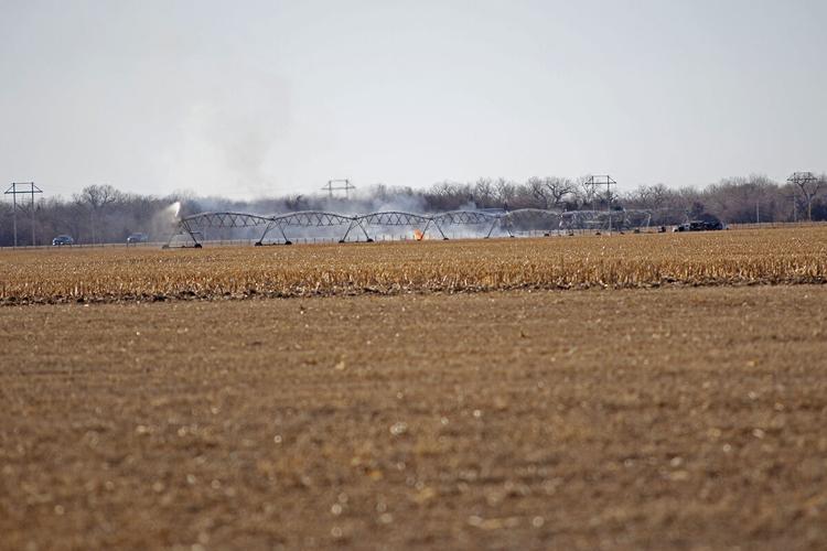 Grass fire near pivot in pogress