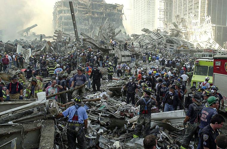 An army of first responder sift through the rubble at Ground Zero on Sept. 12, 2001 during search and rescue efforts.
