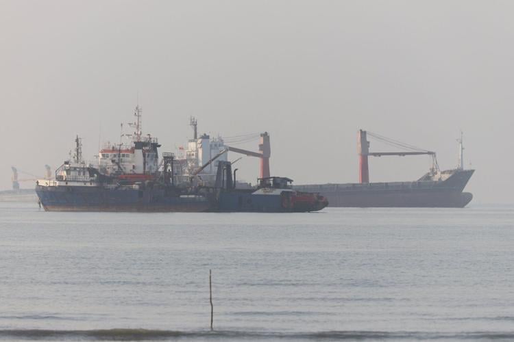 Vessels in the Strait of Hormuz are visible near the beach of Bandar Abbas