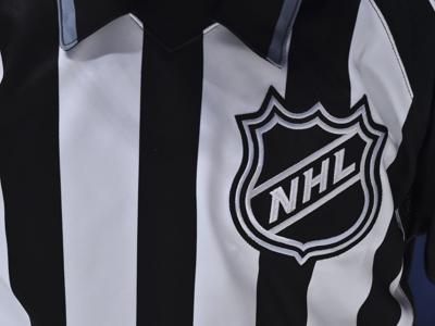 The NHL crest is seen on a linesmans jersey during a game between the Montreal Canadiens and the Ottawa Senators during the third period on Dec. 11, 2019 at the Bell Centre in Montreal, Canada.
