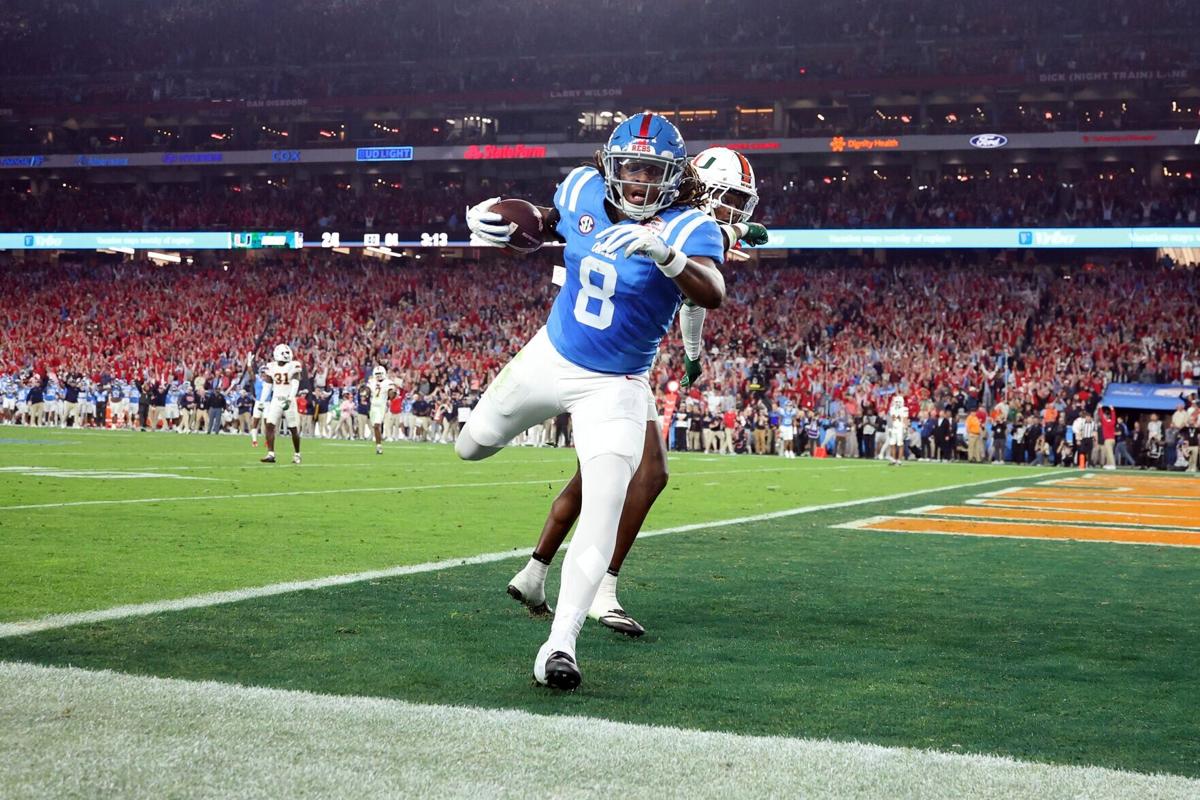 Dae'quan Wright of the Ole Miss Rebels catches a pass for a touchdown against the Miami Hurricanes during the 2025 College Football Playoff Semifinal at the VRBO Fiesta Bowl at State Farm Stadium on Jan. 8, 2026, in Glendale, Ariz..