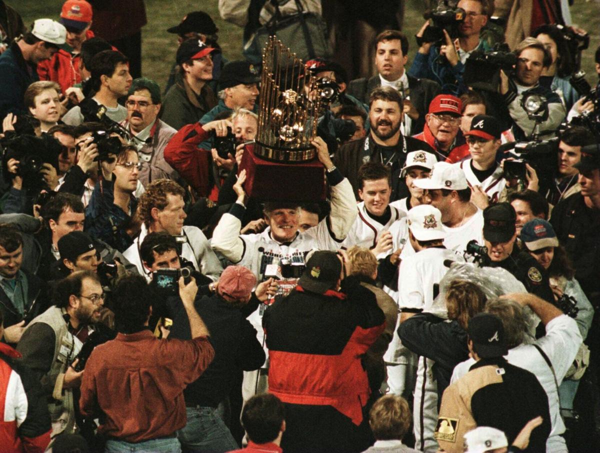 Atlanta Braves owner, Ted Turner, parade the World Series trophy around Fulton County Stadium in Atlanta, Georgia on Oct. 28, 1995, after Atlanta defeated Cleveland 1-0..
