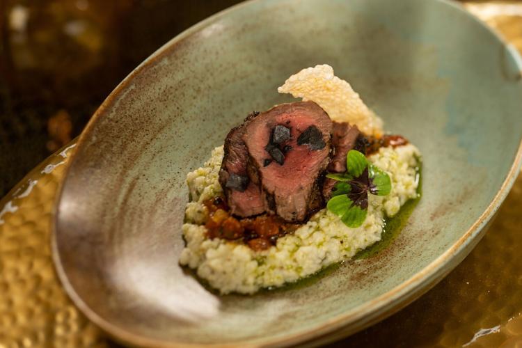 Braai'd Wild Boar Tenderloin with creamy pap, tomato chakalaka, herb-smoked oil, a beautiful selection off the appetizer menu at Jiko- The Cooking Place, which celebrates 25 years in 2026..