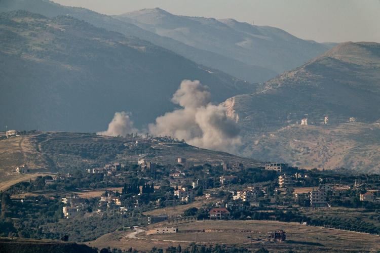 Smoke rises in southern Lebanon following an airstrike, near the border with Israel