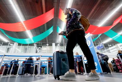 A traveler walks through O'Hare International Airport in Chicago, Illinois, on Nov. 25, 2025, ahead of the upcoming Thanksgiving holiday.