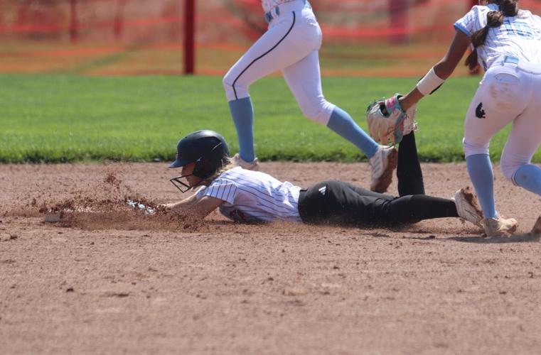 Ella Baal steals second base