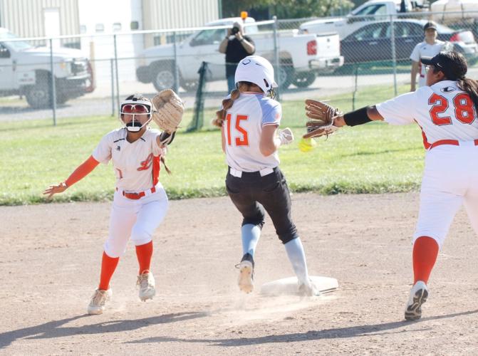 Daisy Villalon and Andrea Gomez-Sanchez attempt an out