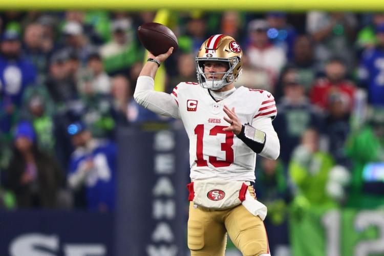 San Francisco 49ers quarterback Brock Purdy (13) throws downfield against the Seattle Seahawks during the first half in an NFC Divisional Round game at Lumen Field in Seattle on Jan. 17, 2026.