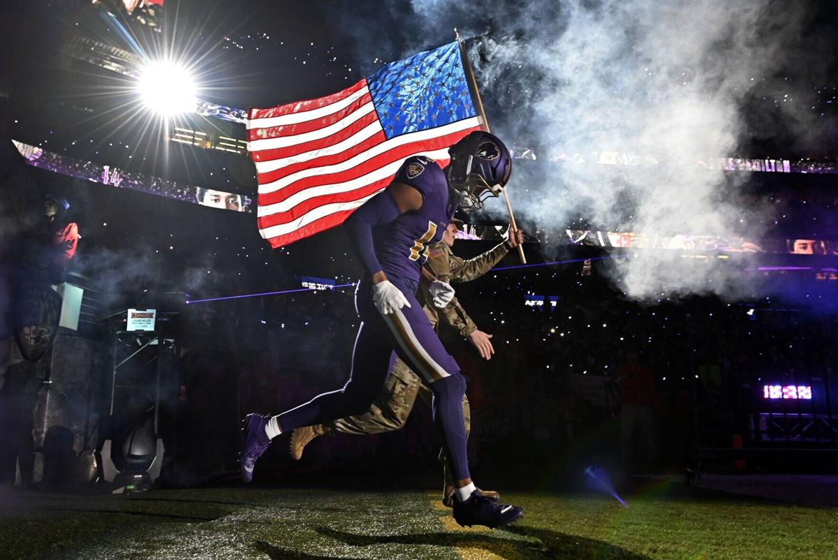 The Baltimore Ravens’ Kyle Hamilton, right, is introduced before a game against the Cincinnati Bengals at M&T Bank Stadium on Nov. 7, 2024, in Baltimore.