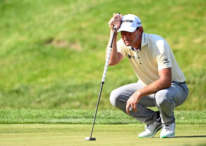 Lucas Glover lines up his putt on the 9th hole during the second round of the John Deere Classic golf tournament.