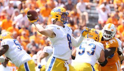 In this file photo from September 11, 2021, Kenny Pickett of the Pittsburg Panthers passes the ball against the Tennessee Volunteers at Neyland Stadium in Knoxville, Tennessee.