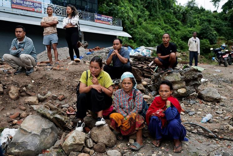 Around the world, people desperately search for news of missing loved ones after Nepal-China floods
