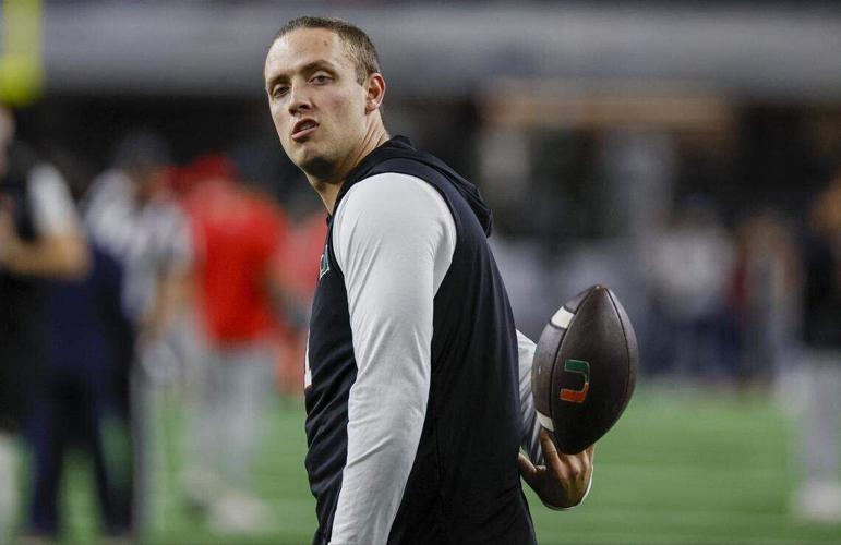 Miami Hurricanes quarterback Carson Beck tosses the ball during warmups before the College Football Playoff quarterfinal game against the Ohio State Buckeyes in the Cotton Bowl at AT&T Stadium in Arlington, Texas on Wednesday, December 31, 2025.