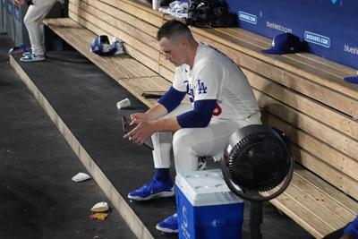 Los Angeles Dodgers pitcher Tarik Skubal sits in the dugout at Dodger Stadium.