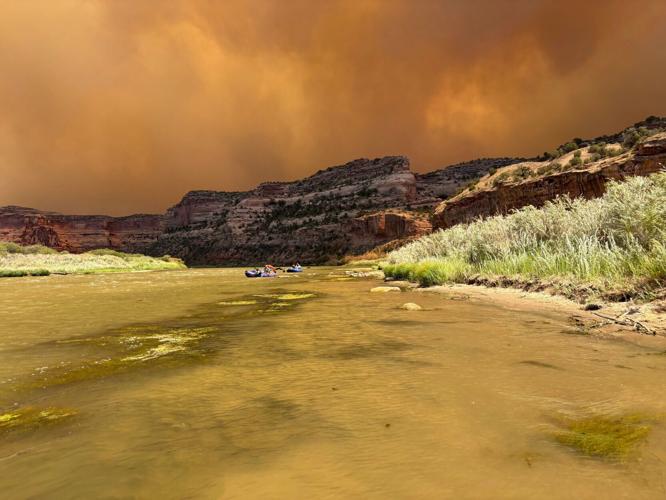 Smoke from the Snyder Fire in Colorado and Utah fills the sky as Sidney Burleson and her friends raft down the Colorado River for her bachelorette party on June 27, 2026.
