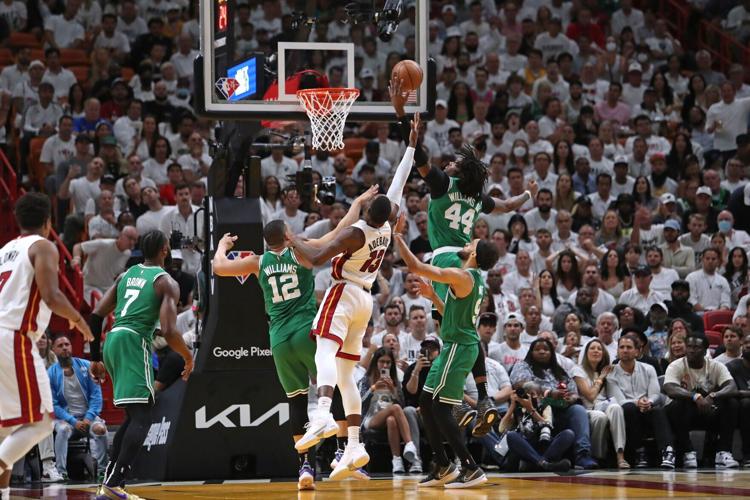 Miami Heat center Bam Adebayo loses the ball to Boston Celtics center Robert Williams during the first half of Game Seven of the Eastern Conference Finals playoff game at FTX Arena on Sunday, May 29, 2022, in Miami.