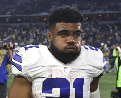 Dallas Cowboys running back Ezekiel Elliott (21) stands on stands